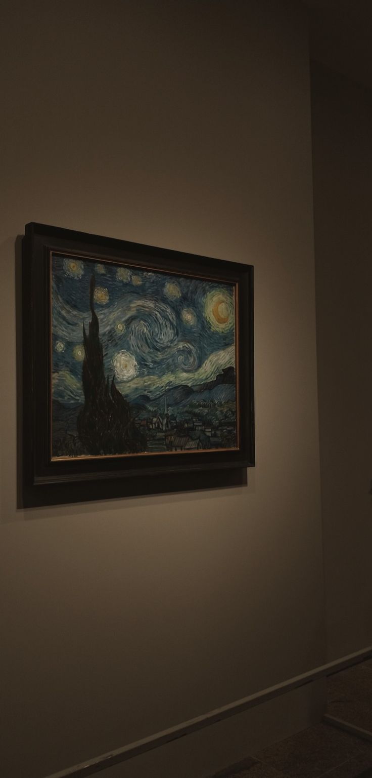 a painting hanging on the wall in a room