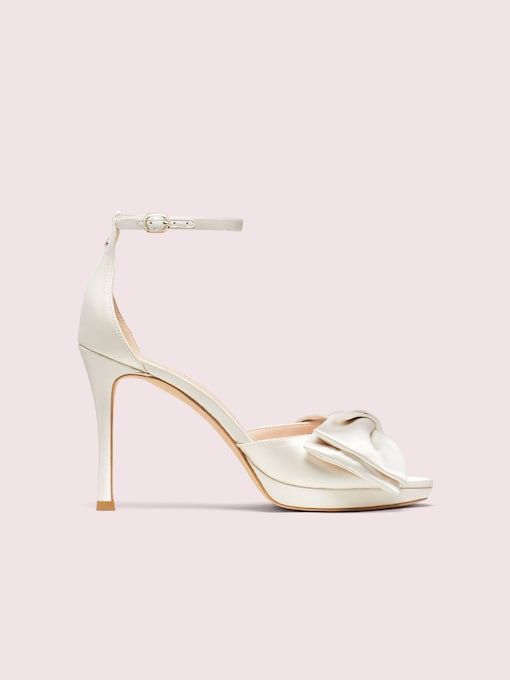 Bridal Bow Sandals | Kate Spade New York Elegant Sandals With 4-inch Heel And Ankle Strap, Leather Wedding Shoes With 4-inch Open Heel, Closed Toe Sandals With 4-inch Heel For Gala, Chic Sandals With Ankle Strap And Heel Loop, Leather Sandals With 4-inch Heel For Gala, Chic Sandals With Ankle And Heel Straps, Luxury Wedding Shoes With 4-inch Heel And Ankle Strap, Elegant Kate Spade Ankle Strap Heels, Formal Wedding Shoes With Heel And Toe Straps