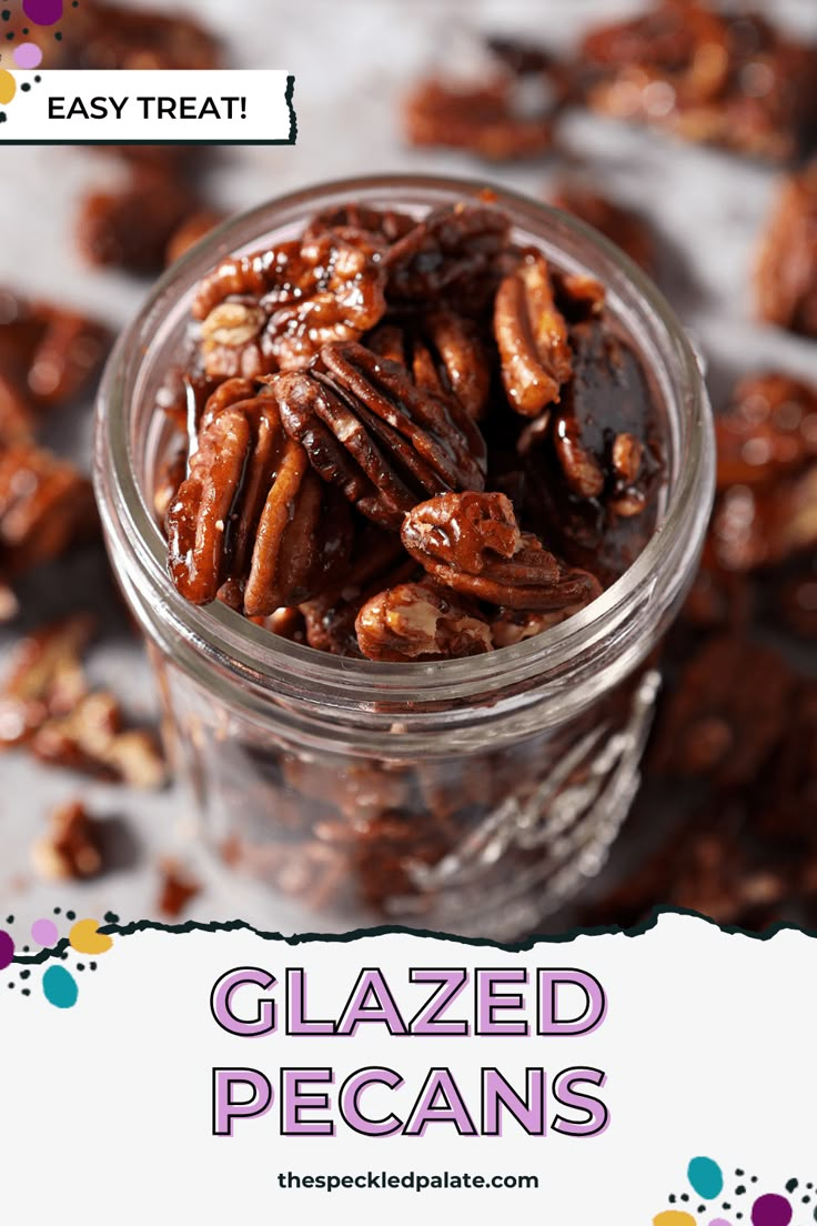 a jar filled with glazed pecans sitting on top of a table next to a sign that says easy treat