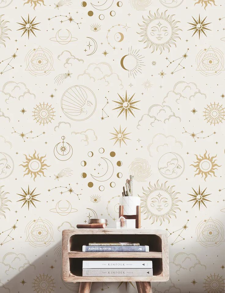 the wallpaper in this room is decorated with gold stars and crescents