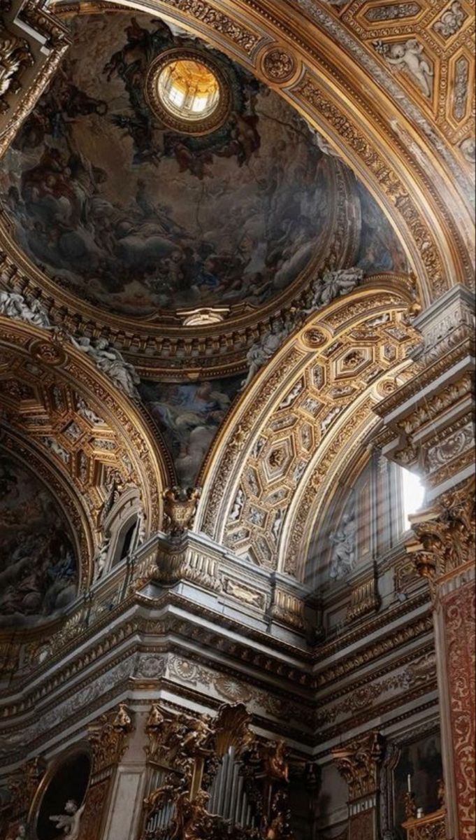 the interior of an ornate church with gold and black decor