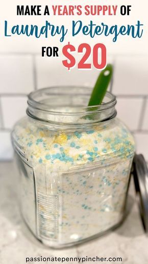 a jar filled with blue and yellow sprinkles on top of a counter