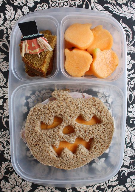 a plastic container filled with food on top of a table