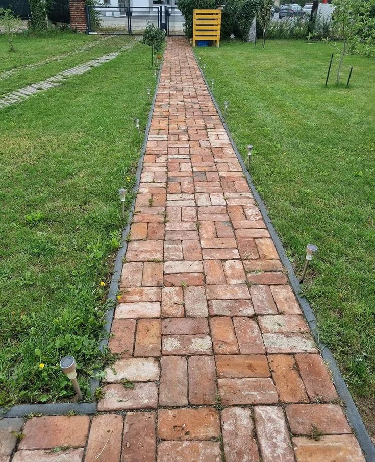 a brick path in front of a house