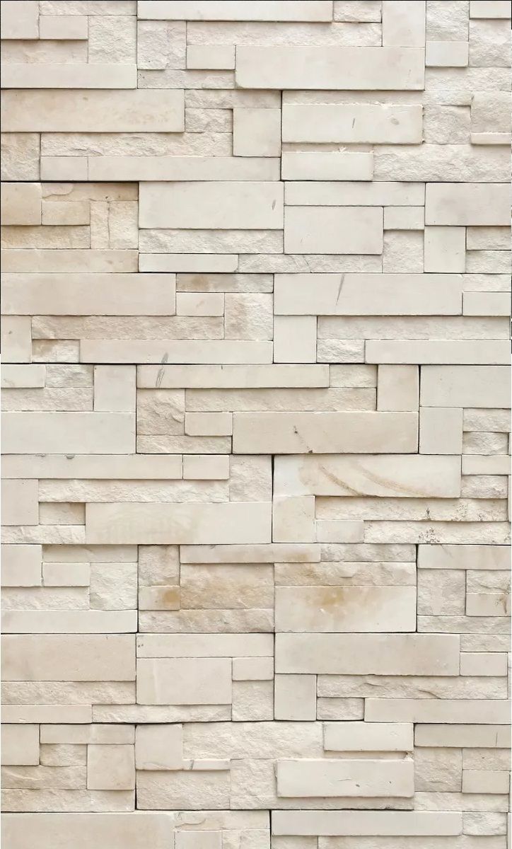 a white brick wall that is made out of stone