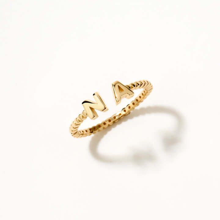 Adorn your fingers with our Double Initial Bead Ring in 14K Solid Gold, a perfect piece to make a style statement. This delicate 14k yellow gold custom ring not only adds a touch of elegance but also personalizes your style with bubble initials. Ideal for women, this dainty two letters bead ring makes for a perfect birthday gift. Its unique design and quality craftsmanship make it a must-have item in your jewelry collection. 14k solid gold handcrafted pieces 100% ethical sourced jewelry Material Personalized Initial Ring, Initial Rings, Halo Necklace, Solid Gold Band, Custom Ring, Initial Ring, Letter Beads, Personalized Rings, Personalized Initials