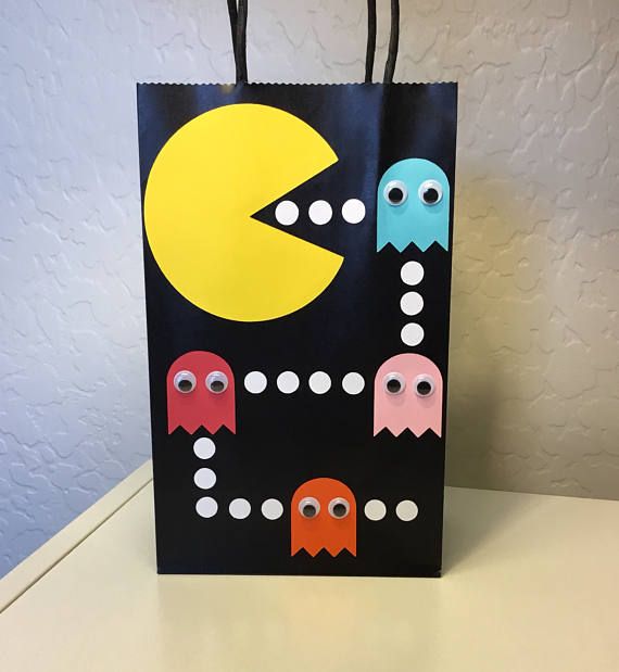 a paper bag with pacman faces on it