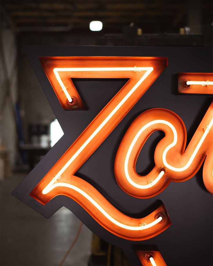 a large neon sign with the letter z on it's side in an industrial building