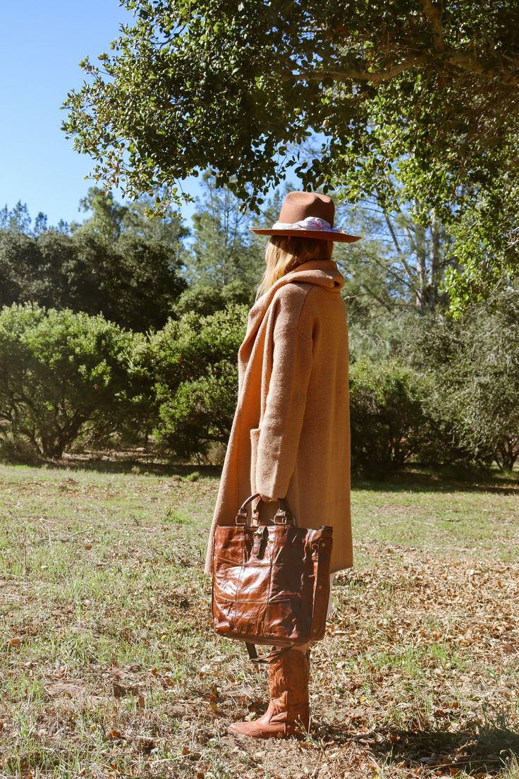 A match made in heaven: The Lennox Sweater Coat + The Crossroads Leather Bag 🤎⁠ We're obsessed with this bohemian chic look, put together by our free-spirited muse @cayden.naughton featuring our best-selling Lennox oversized cardigan & the fan-favorite leather Crossroads tote bag!⁠ ⁠ #bohemianstyle #sweaterweather #californiawinter #casualoutfit #cozyvibes #stylinginspo #lotd #ootd #momlife #californiastyle Oversized Brown Wool Coat For Fall, Casual Brown Wool Coat For Fall, Cozy Brown Sweater Coat For Everyday, Beige Sweater Coat For Cold Weather In Fall, Cozy Brown Everyday Outerwear, Brown Sweater Coat For Winter, Oversized Camel Winter Outerwear, Oversized Brown Outerwear For Everyday, Brown Wool Coat For Cold Weather In Fall