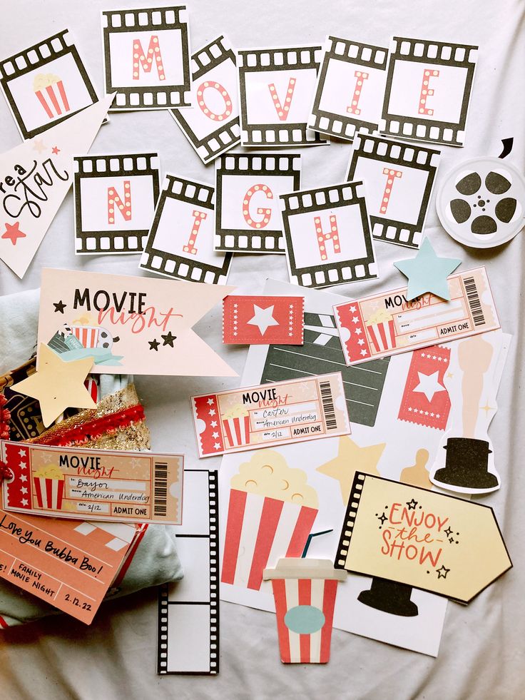 some movie themed items are laying out on a sheet of paper with the words movies written across them