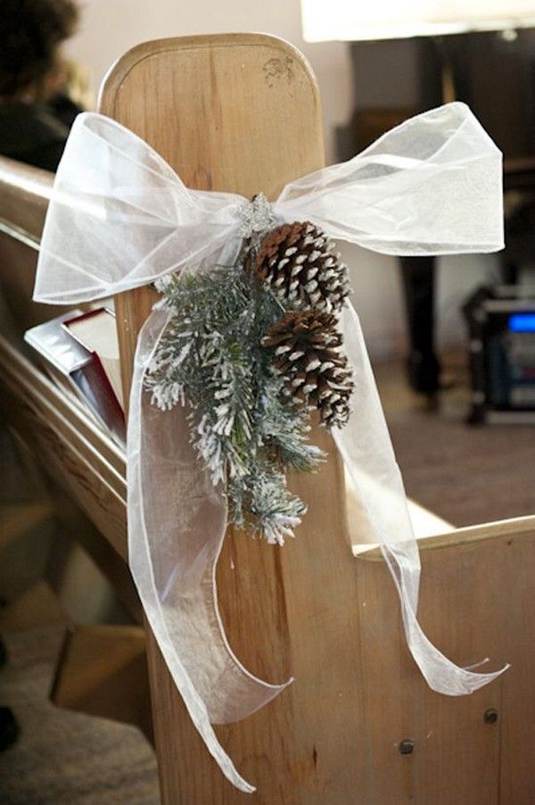 a wooden chair with a pine cone tied to it