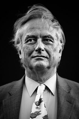 black and white photograph of an older man wearing a suit with trees on the tie