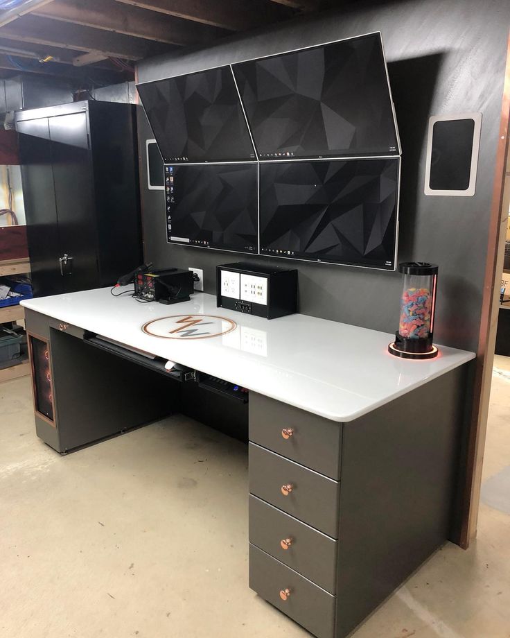 an office desk with black and white decor