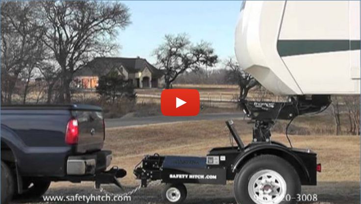 a truck pulling a trailer behind it on the road