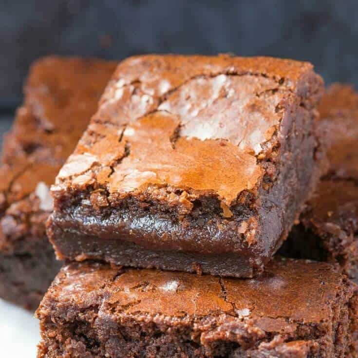 chocolate brownies stacked on top of each other