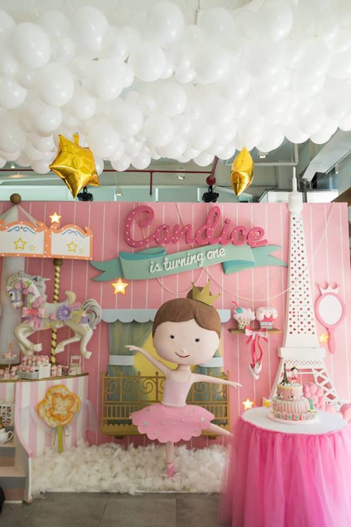 a pink and gold birthday party with balloons, decorations and decorating on the walls