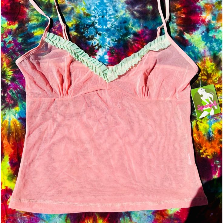 Super Cute Mesh Cami With Ruffle Lovely Pastel Color Pallet Spree Girl Embodies The Spirit Of The California Girl Who Exudes Confidence And Enjoys A Care Free Lifestyle Make A Reasonable Offer! Get Your Barbie On In This Cutee! Pink Y2k Tops For Spring, Y2k Pink Tank Top For Summer, Pink Y2k Style Tops For Spring, Y2k Style Pink Summer Tank Top, Spring Pink Cami Tank Top, Pink Cami Tank Top For Spring, Pink Camisole Tank Top For Summer, Summer Y2k V-neck Camisole, Pink Y2k V-neck Top