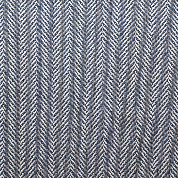 an upholstered blue and white herringbone fabric