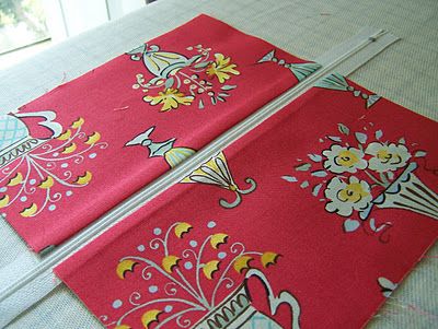 two red placemats sitting on top of a table