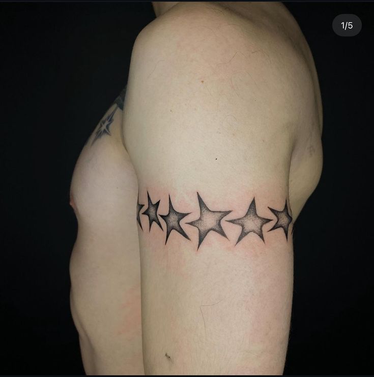 a man's arm with stars on it