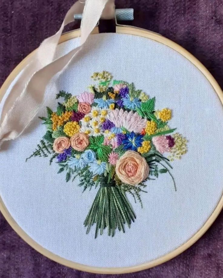 a bouquet of flowers is on the hoop