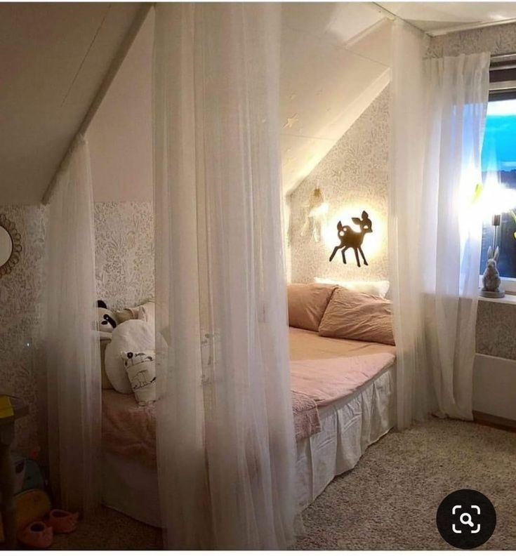 an instagramted photo of a bedroom with white curtains on the windowsills