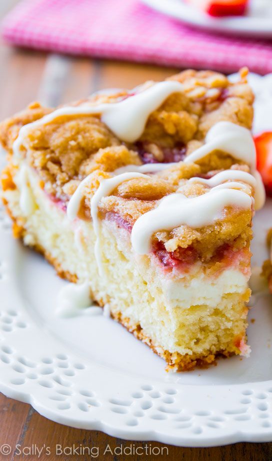 a close up of a piece of cake on a plate with icing drizzled