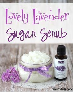 lavender sugar scrub in a glass jar next to a bottle of lavender essential oil on a wooden table