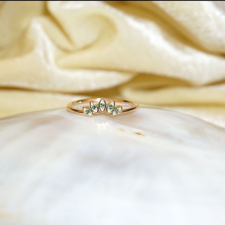 "Materials Gold, Rose gold, White gold Gemstone: Natural Emerald 14k Gold Art Deco Emerald Ring / Wedding Ring / Stackable Emerald Ring / Crown Ring / Solid Gold Ring / Wedding Ring / Emerald Crown Ring Item Details ✔ Made to Order ✔ Gold Kt: 14K (also available in 18K) ✔ Available Gold Color: Rose Gold, Yellow Gold, White Gold ✔ Total ctw: 0.06 Ctw ✔ Width of Band: 1.4MM ✔ Ready to Ship in 7-10 Business Days If you have any additional questions about this ring, just hit the \"Ask a Question\" b Heirloom Gold Emerald Stackable Ring, Elegant Gold Topaz Adjustable Ring, Gold Stackable Promise Rings With Gemstones, Gold Gemstone Stackable Rings For Promise, Gold Emerald Ring Stackable Fine Jewelry, Gold Marquise Emerald Ring In 14k Gold, Gold Opal Open Ring For Promise, Gold-tone Topaz Open Ring For Promise, Gold Topaz Open Ring For Promise