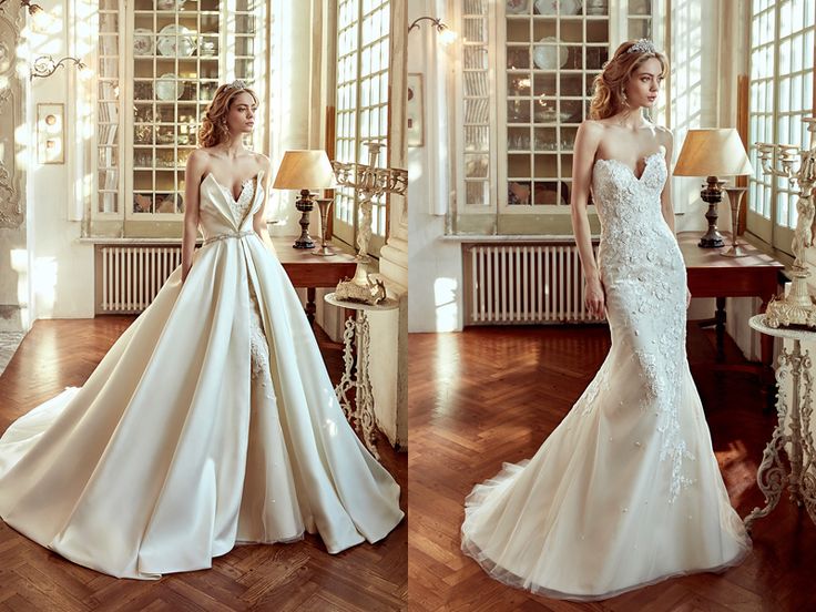 two beautiful women in wedding gowns standing next to each other on the wooden floor