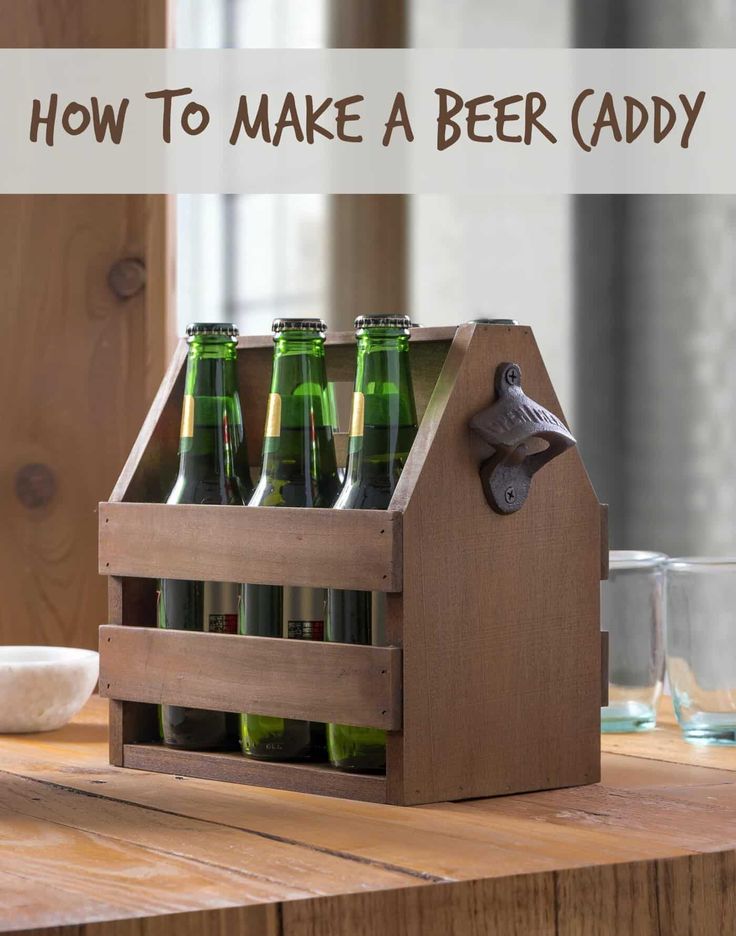 a wooden crate filled with beer bottles on top of a table