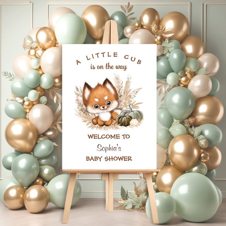 a welcome sign for a baby shower with balloons around it and a fox on the front