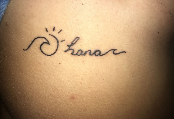 a woman's stomach with the word shana written in cursive font