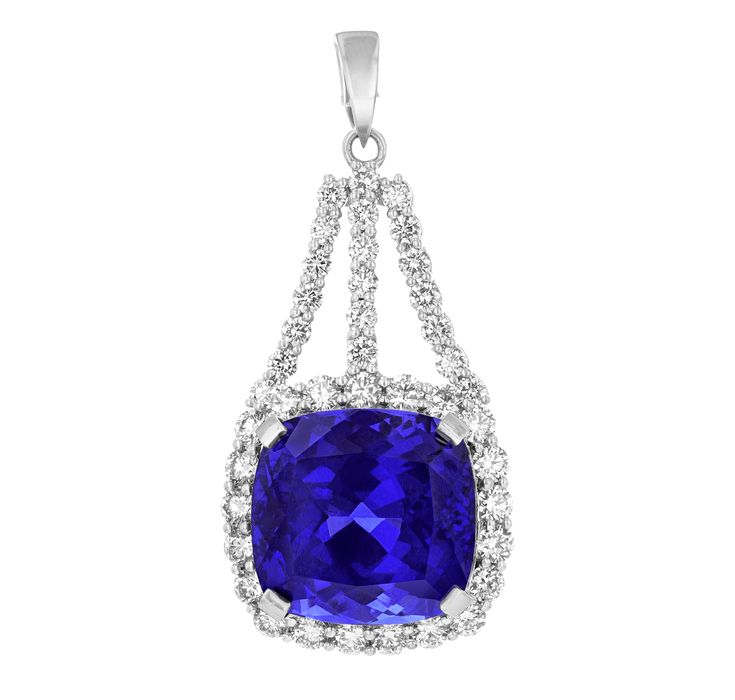 An astounding 31.24-carat cushion-cut tanzanite is set in this pendant. The gem displays a highly saturated "bluish-violet" hue as stated in its certification from the Gemological Institute of America (GIA). Its suspended form is encased by a halo of white diamonds, which total approximately 3.10 carats. Set in 18K white gold. When discovered in the hills of Mount Kilimanjaro in 1967, tanzanites were first thought to be an alternative type of sapphire. Upon further investigation, however, the stone’s properties were seen to be more complex and unique. The stone was christened with the name “Tanzanite” by Henry B. Platt, president and chairman of Tiffany & Co., at the 1968 World's Fair, where its vibrant blue-violet color dazzled visitors. While many tanzanites display a light, violet hue, Golconda Diamond, Tanzanite Pendant, Light Violet, Mount Kilimanjaro, Violet Color, World's Fair, Blue Violet, Fine Jewels, The Hills