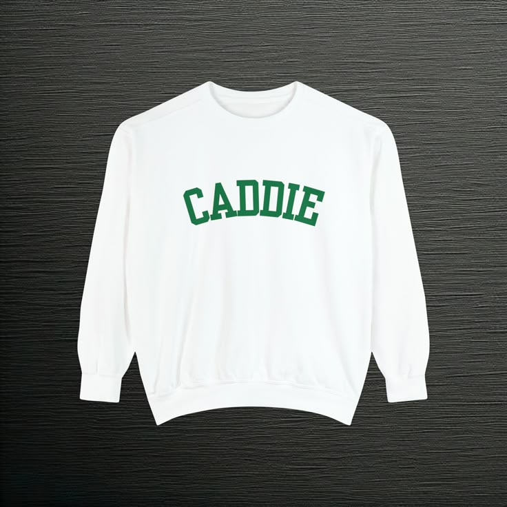 "Introducing the \"Caddie\" Sweatshirt Pullover, designed exclusively for avid golf enthusiasts who appreciate style and functionality on and off the course. Crafted with the discerning golfer in mind, this premium pullover seamlessly combines comfort and performance, ensuring you stay at the top of your game in any weather. Made from a luxurious blend of high-quality cotton and polyester, the Caddie Sweatshirt Pullover offers a soft touch against your skin while providing excellent moisture-wic Groomsmen Gifts Golf, Golf Sweatshirt, Golf Mom, Golf Hoodie, Golf Gifts For Men, Golf Wang, Golf Gift, Golf Apparel, Sweatshirt For Women