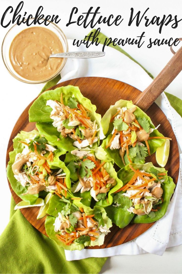 chicken lettuce wraps with peanut sauce in a bowl on a wooden platter