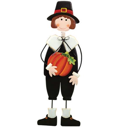 a scarecrow with a pumpkin in his hand