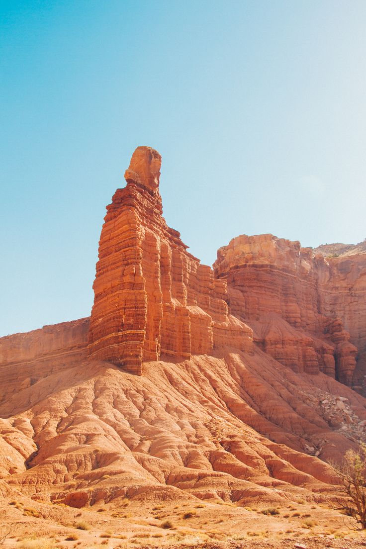 a large rock formation sitting in the middle of a desert