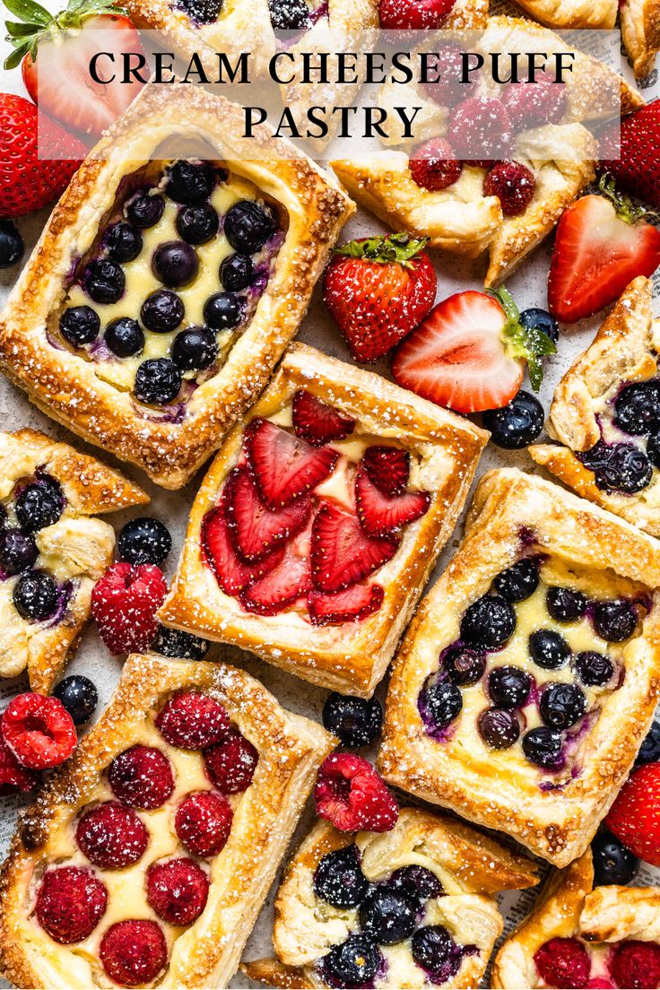 fresh fruit tarts are arranged on a white surface