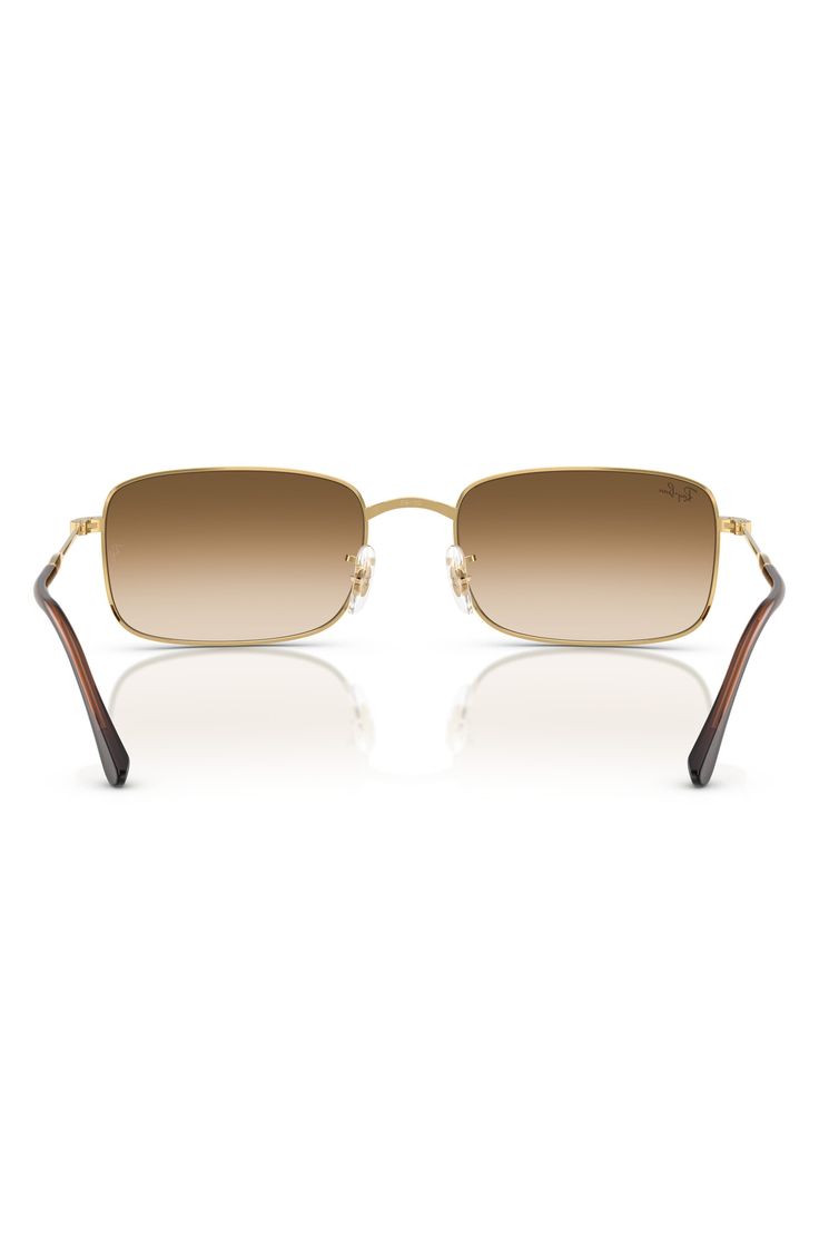 A sleek rectangular silhouette adds retro-cool appeal to stylish sunnies fitted with adjustable nose pads for a secure fit. 59mm lens width; 20mm bridge width; 145mm temple length 100% UV protection Adjustable nonslip nose pads Metal Imported Classic Rectangular Sunglasses For Summer, Classic Brown Rectangular Shield Sunglasses, Modern Rectangular Sunglasses With Mirrored Lenses, Brown Rectangular Aviator Sunglasses With Gradient Lenses, Classic Rectangular Shield Sunglasses For Summer, Casual Rectangular Metal Frame Sunglasses, Classic Rimless Aviator Sunglasses With Uv Protection, Classic Rimless Aviator Sunglasses With Tinted Lenses, Classic Rimless Aviator Sunglasses With Mirrored Lenses