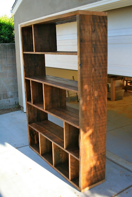 a wooden shelf sitting in the middle of a driveway