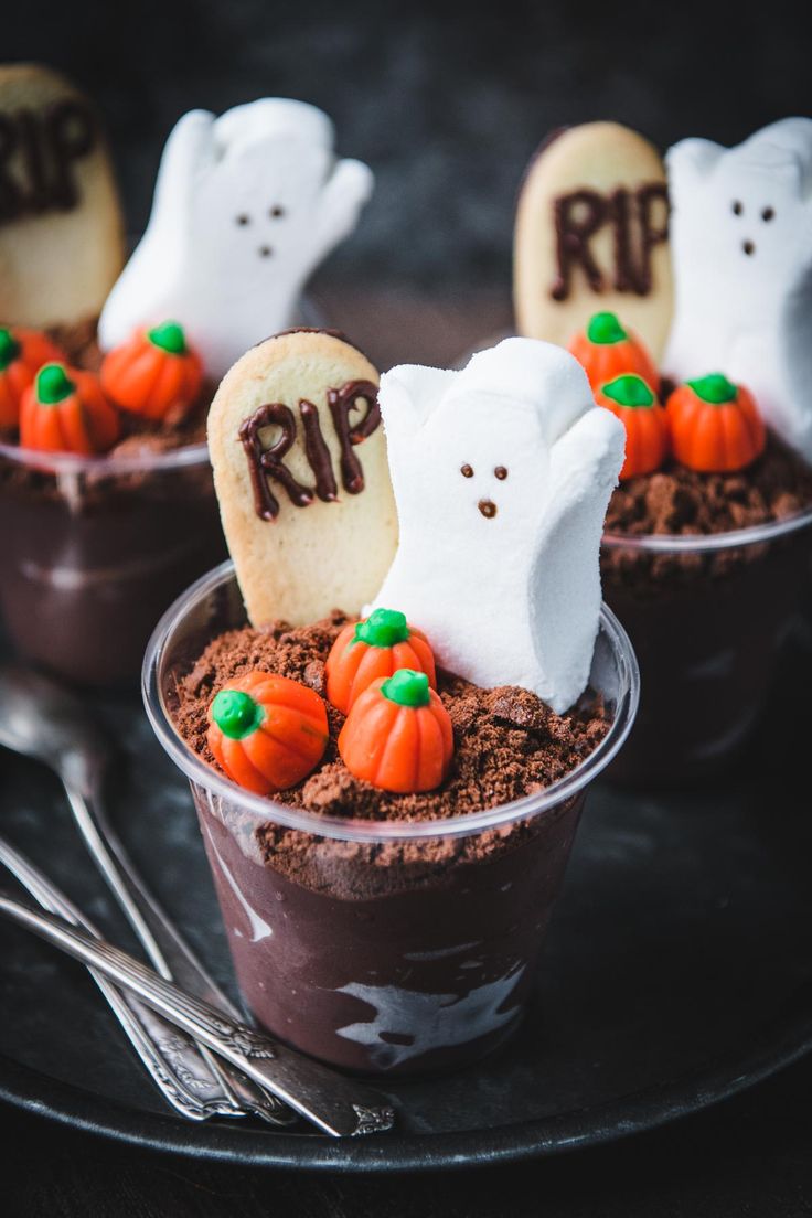 halloween desserts in small plastic cups with ghost decorations