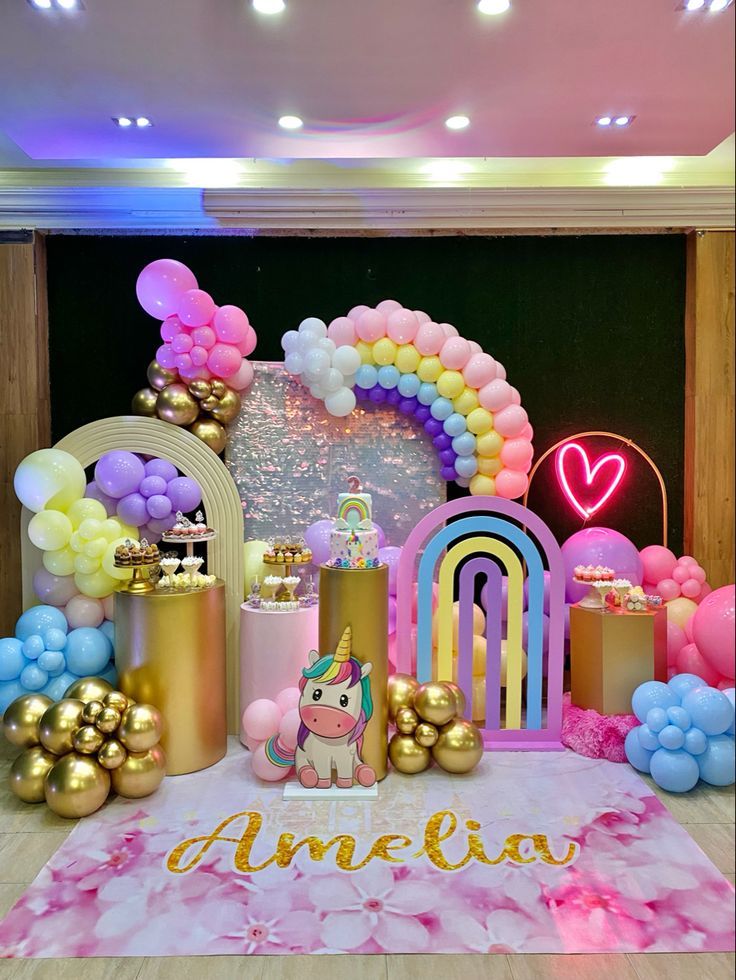 a unicorn themed birthday party with balloons and decorations