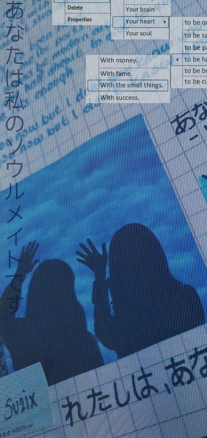 an image of two people with their hands up in front of a poster that has japanese characters on it