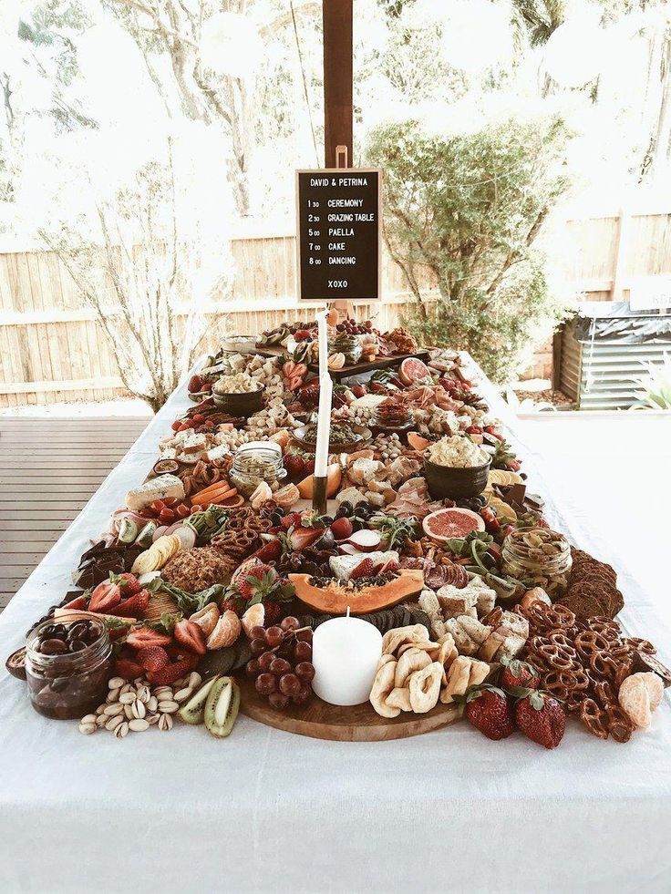 a table topped with lots of food and a sign that says, i love you