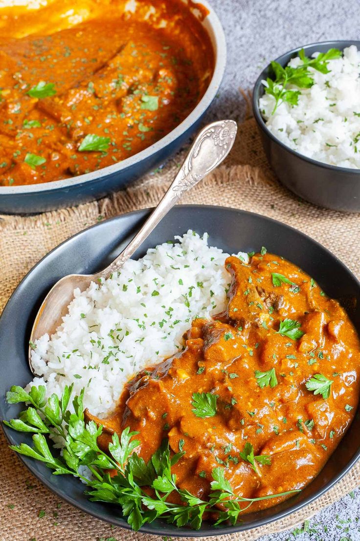 two bowls filled with rice and meat curry