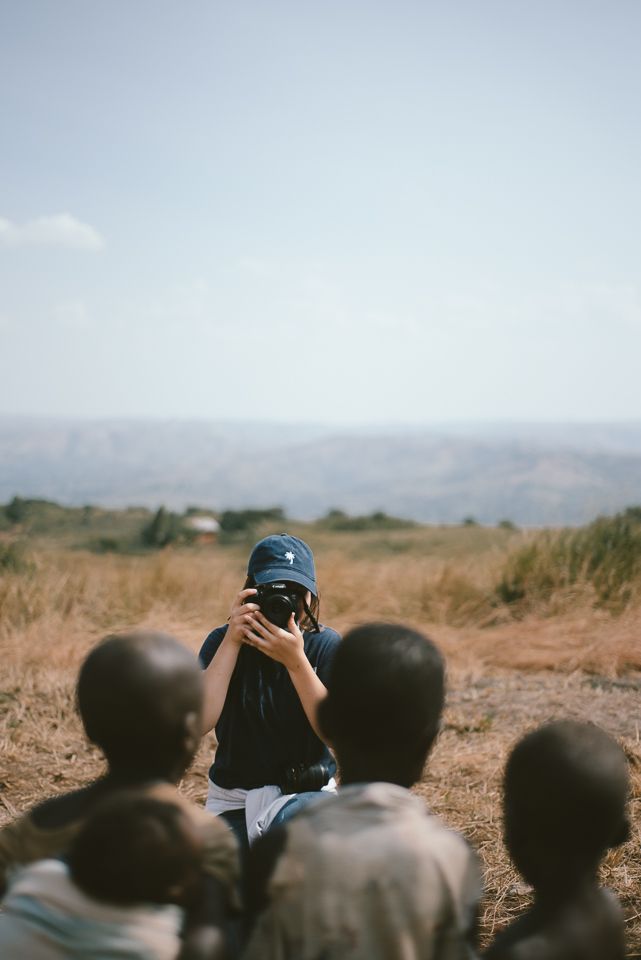 a group of young boys standing around each other