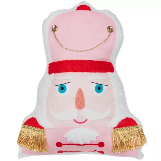 a pink and white stuffed animal with gold trimmings on it's head