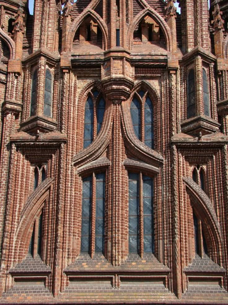 an old building with many windows and arches