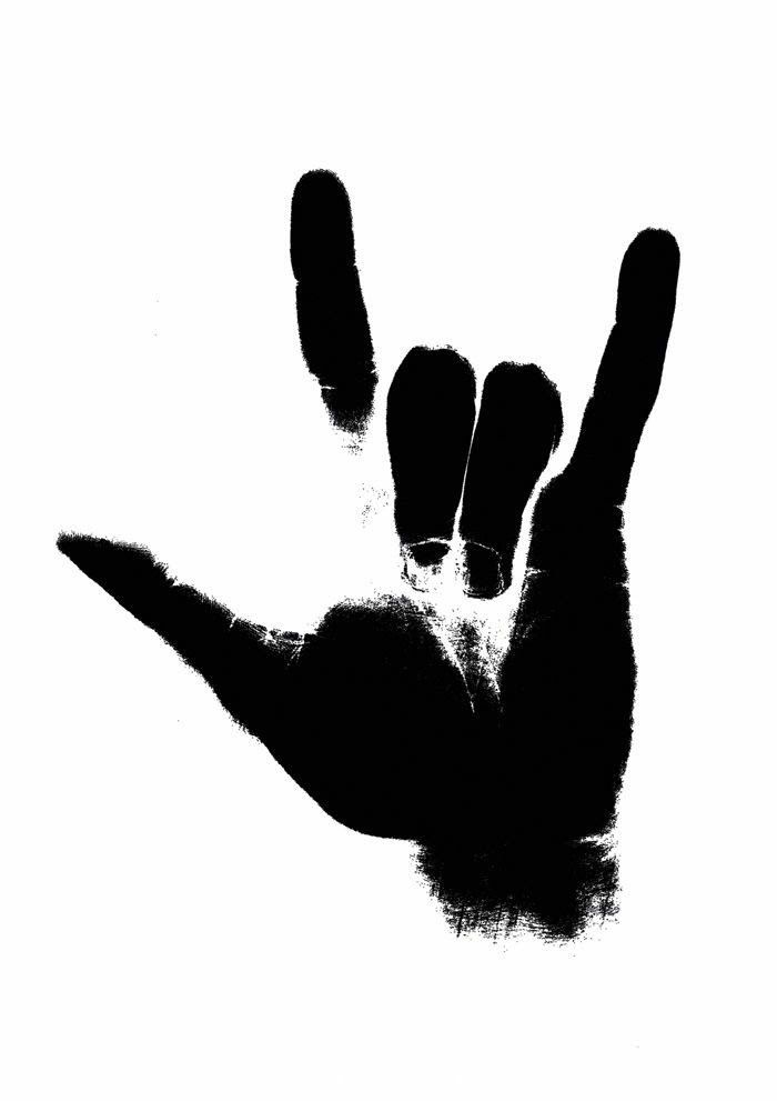 a black and white photo of a person's hand holding up the middle finger